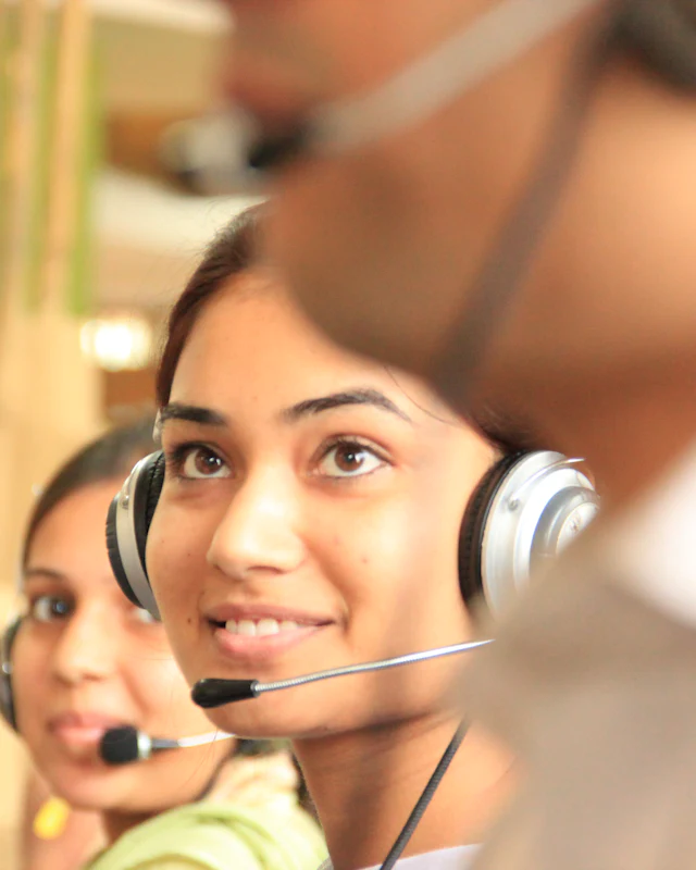 Smiling customer support team member wearing a headset