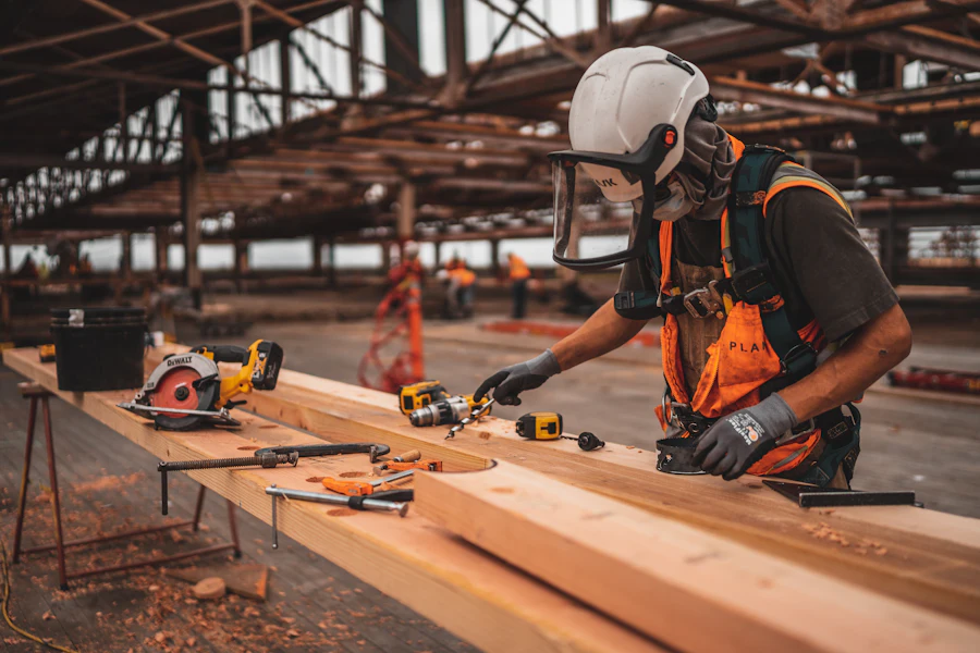 Site supervisor in a hard hat and high-visibility vest