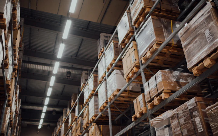Shelving stocked with boxed supplies in a storeroom